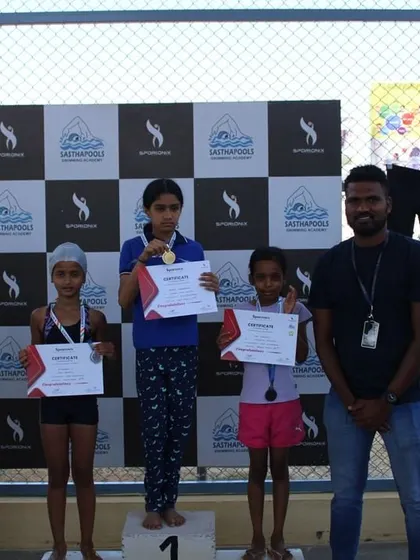 The winners of a junior swimming category, marking the start of their competitive journey.