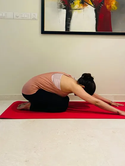 A moment of mindful rest in a child's pose. We believe rest is just as important as the work, and we encourage guilt-free recovery days.