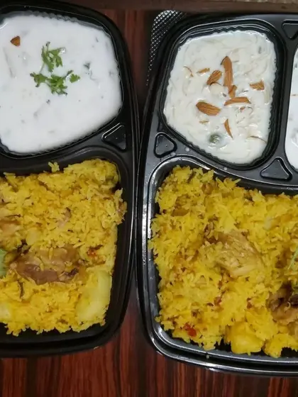 Here is another one of our delicious meal combos, featuring a flavorful chicken pulao. We ensure every meal, complete with sides like raita and a dessert, is prepared with fresh ingredients for that authentic homemade taste.