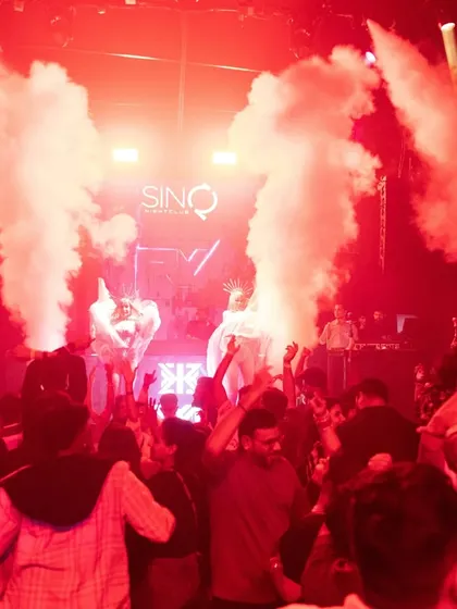 The crowd goes wild as smoke cannons erupt at Sinq. This is that peak-time moment everyone waits for, and I'm there to deliver it.
