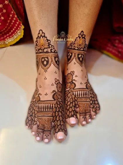 A unique design where the peacock's flowing tail feathers create the pattern across the foot.