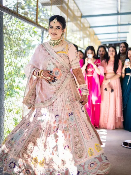 The bride's grand entry, with her bridesmaids looking on in admiration.