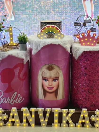 A close-up of the Barbie themed pedestals and the light-up name 'Anvika'.