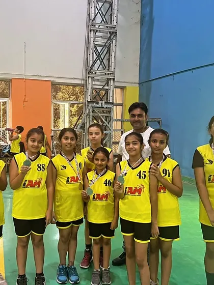 Our girls' team proudly showing off their medals from the Inter-Society Tournament.