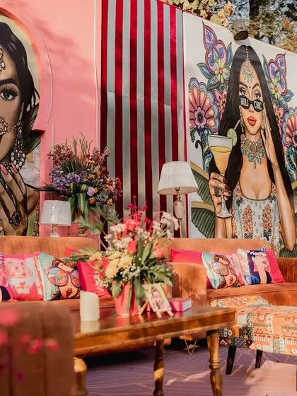 Let's make your Mehendi pop! 🎨 For this celebration, I used bold, custom pop-art caricatures to create a backdrop that was as vibrant and unique as the couple. Paired with plush seating and eclectic cushions, it’s a perfect example of how I infuse personality into every corner.