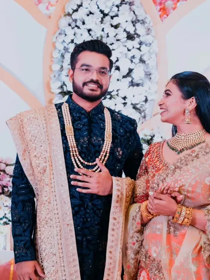 A candid moment of admiration between the couple on their reception stage.