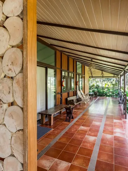 The beautiful wooden-paneled corridor of our Kabini resort, adding to the rustic and natural feel of the property.