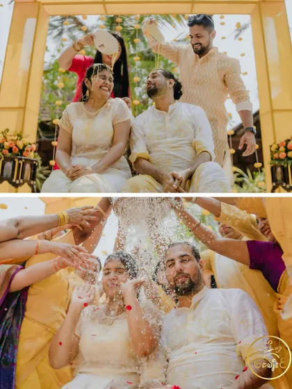 More happy moments from the Haldi, capturing the couple's laughter as they are blessed with water and petals.