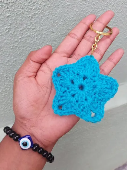 A simple yet cute crochet star keychain in bright blue. These are great for party favors.