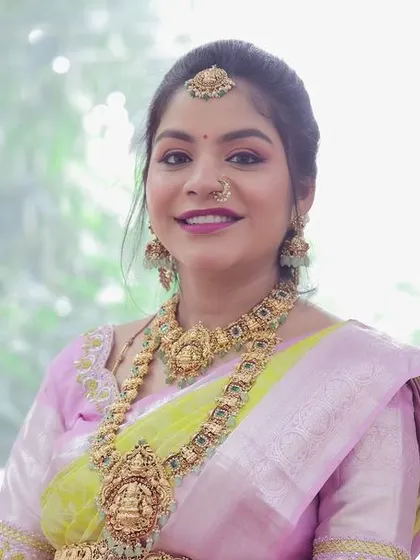 A glowing mom-to-be celebrating her baby shower in one of my classic temple jewellery sets, featuring a Lakshmi pendant.