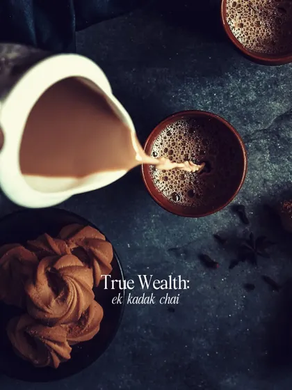 True wealth: a cup of strong chai. This top-down shot of tea being poured into a traditional kulhad is a celebration of one of life's simplest and greatest pleasures.