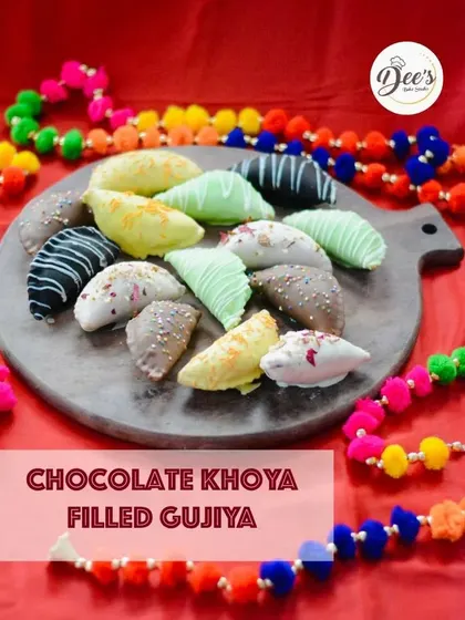 A platter of our famous Chocolate Khoya Filled Gujiyas. We offer them in a variety of toppings, from classic chocolate drizzles to colorful coatings, making them a beautiful addition to any Holi party.
