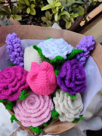 A close-up of a mixed bouquet with roses, tulips, and lavender. I love combining different textures and colors to create a visually interesting arrangement.