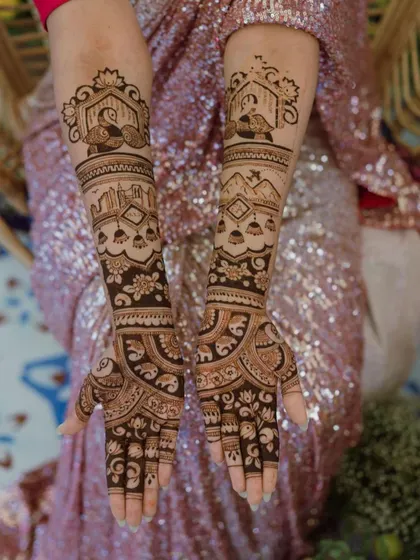 This stunning bridal mehendi features architectural elements and peacocks, creating a regal and picturesque design.