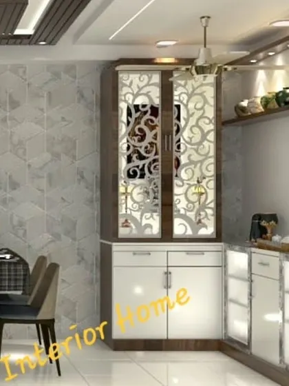 A closer view of the integrated pooja and crockery unit, highlighting the detailed jali work on the mandir doors.