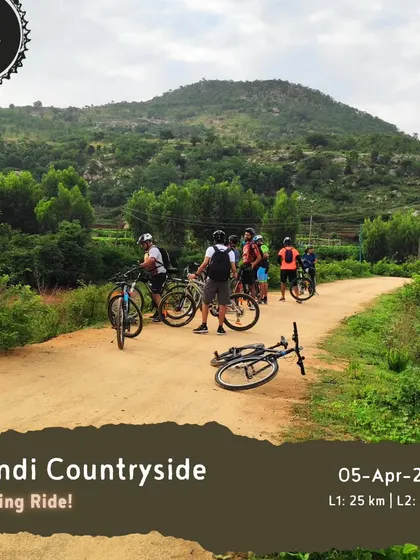 Our 'Nandi Countryside' evening ride is a great way to beat the heat. This image shows a group taking a break on a scenic dirt road, with options for both beginner and intermediate levels.