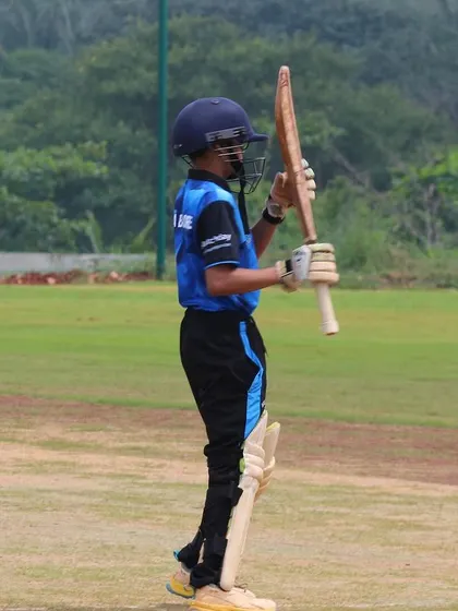 A young cricketer acknowledges his teammates after a good performance, a sign of the sportsmanship we instill in our players.