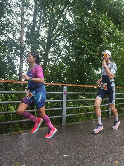 Side by side with another runner. We're all in this together, pushing our own limits.