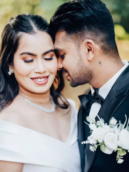 Another beautiful, intimate moment. The close-up shows the detail of her makeup and the genuine emotion between the couple.