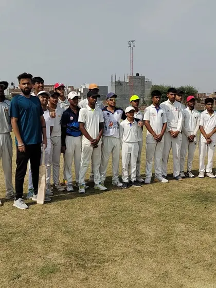 Our team of young, dedicated cricketers with one of our coaches. We work to build a strong sense of community and discipline, creating a supportive environment where every player is mentored and encouraged to reach their full potential.