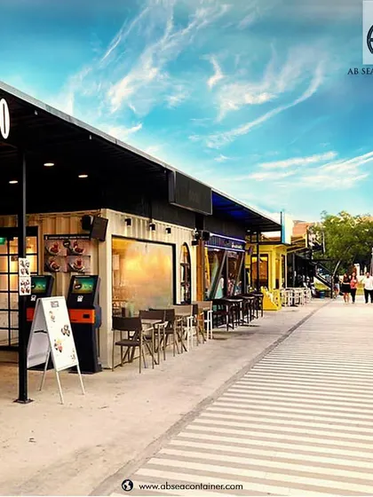 We can create entire streets of container-based retail and dining spaces. This concept shows a bustling bistro and outdoor seating area, perfect for food parks and commercial complexes.