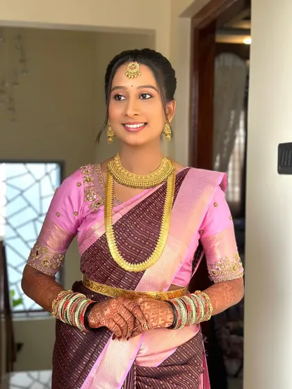 A happy bride-to-be. Her smile is the best accessory. The makeup is designed to be light and comfortable for long hours of rituals and celebrations.