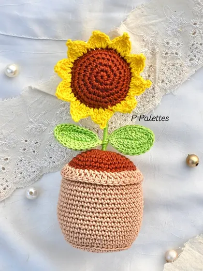 A single crochet sunflower pot, sitting pretty. This is one of our bestsellers and a great way to add a touch of handmade art to your home.