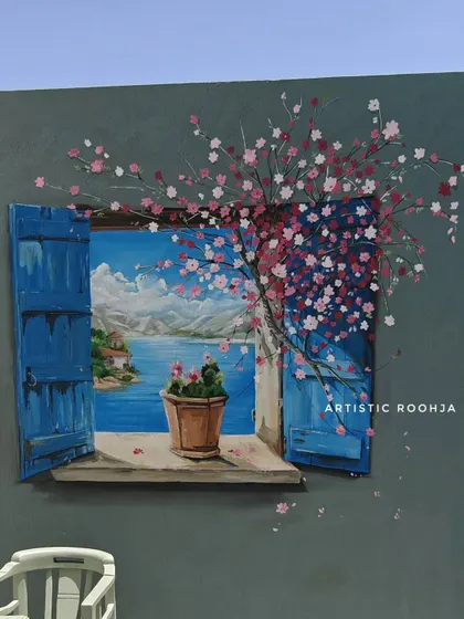 A close-up of the 3D window mural, showing the detail in the cherry blossoms and the illusion of depth in the landscape.