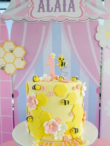 This bee-themed cake is just the sweetest! Decorated with honeycombs and tiny fondant bees, it was the perfect centerpiece for Alaia's party.