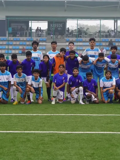 A large group photo of our youth players on the pitch, representing the breadth of talent we nurture at the academy.