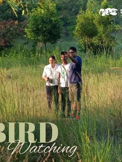 A group on a birdwatching tour takes a moment for a selfie. It's a fun, educational activity that brings people together in their appreciation for nature.