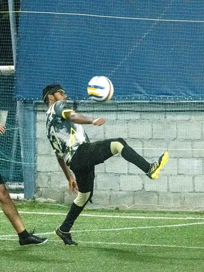 A player executes a perfect volley during a league match. Technical skill and precision are hallmarks of my senior team's playing style.