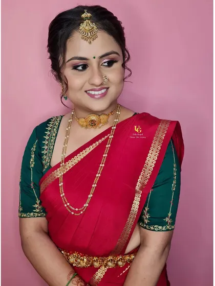 A beautiful profile of Varshini's engagement makeup. This angle highlights the flawless base, the gentle contouring, and the elegant updo that completes her traditional South Indian look.
