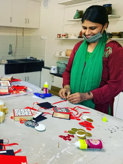 Here is one of our dedicated team members, hard at work creating handmade gift tags. We are so proud of the women who make Crafted Forever possible.