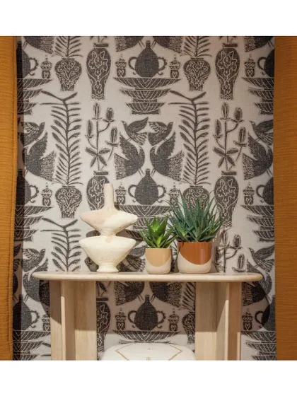 Even an entryway can make a bold statement. This graphic, block-print style wallpaper adds immediate character and artistic flair to a transitional space, setting the tone for the rest of the home.
