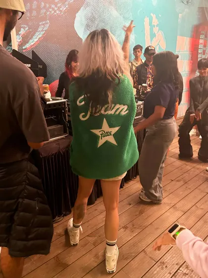 Rocking a cool jacket while playing for a Patta and Converse event. Fashion and music go hand in hand.