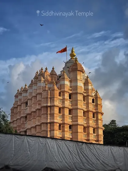 The iconic Siddhivinayak Temple in Dadar, Mumbai, a symbol of faith for millions, captured on a cloudy day.