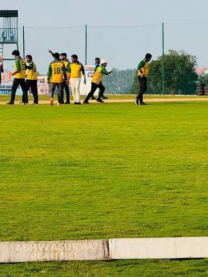 A team celebrates a wicket on our pristine green outfield, a common sight during the many competitive matches hosted here.
