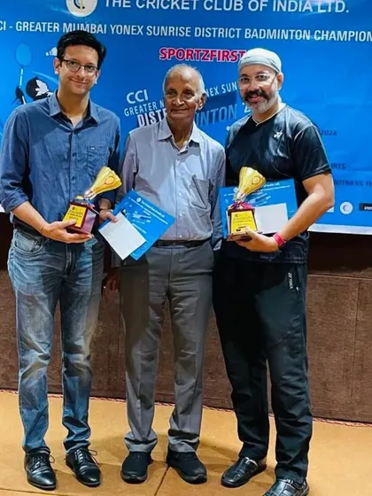 Receiving our winners' trophies at the CCI GMBA District Badminton Championship.