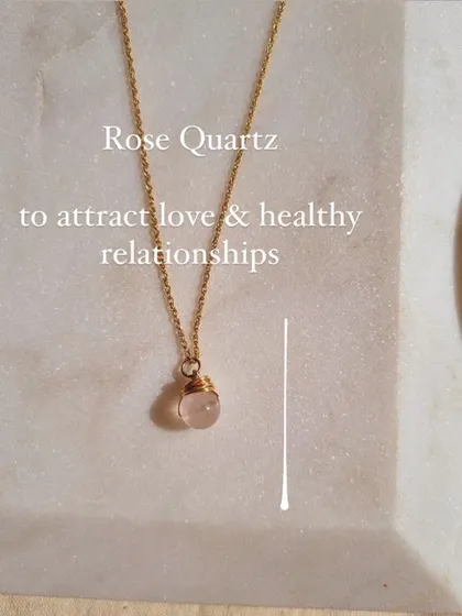 This wire-wrapped Rose Quartz pendant is designed to help you attract love and healthy relationships. The simple design keeps the stone's energy close to your heart, reminding you of your intention throughout the day.