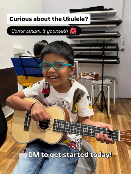 Look at that smile. The ukulele is such a happy instrument, and this is the pure joy I aim for in my classes. This image captures the moment a child connects with music, and the call to action invites other kids to experience it for themselves.