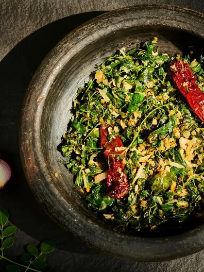 A bowl of Cheera Poriyal, a delicious and wholesome spinach stir-fry. Prepared with fresh greens and aromatic spices, this dish is rich in nutrients and supports detoxification.