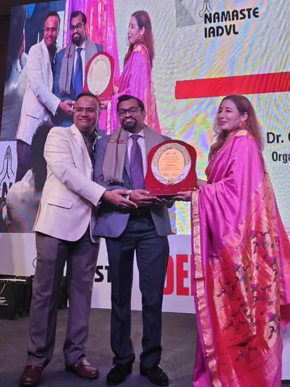 Receiving my appreciation award on stage at Dermazone North & Annual Cuticon DSB 2024. It is a privilege to be recognized by my peers for my contributions to dermatological education.