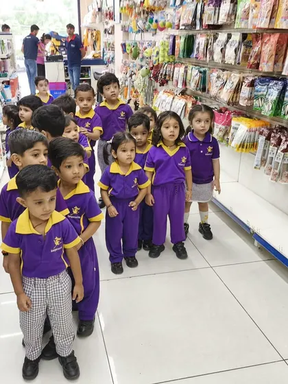 A group of curious preschoolers visiting our Indore Experience Center, learning about pet care from a young age.