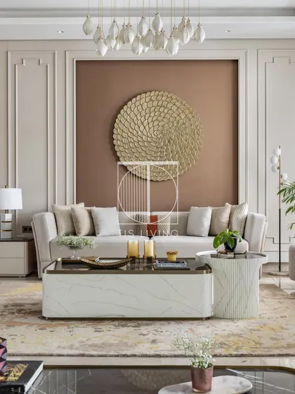 A detailed shot of the living room, focusing on the main sofa and the layered coffee tables. We use materials like marble and brass to add texture and luxury, ensuring each piece is a work of art.