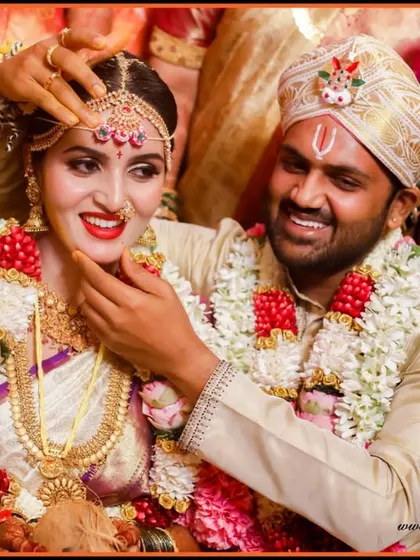 A tender moment during the wedding ceremony. The groom's loving gesture and the bride's happy expression are what make this photograph so special.