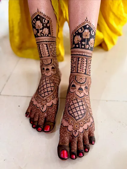 A close-up of the floral ankle band, showing the delicate lotus and leaf motifs.