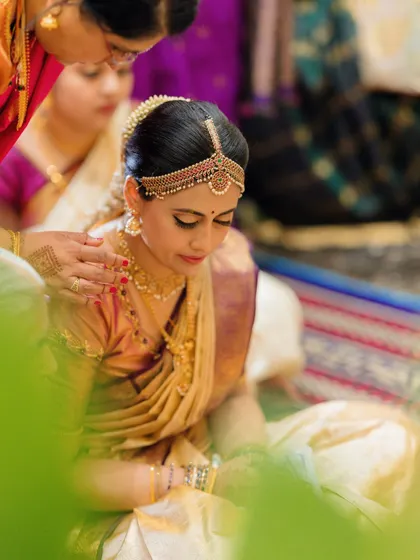 A quiet, contemplative moment, with the focus on her serene expression and the traditional details of her look.