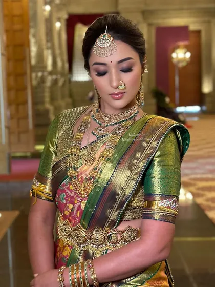 A close-up of the cousin's makeup, featuring a dramatic smokey eye that is balanced by flawless skin and a neutral lip.