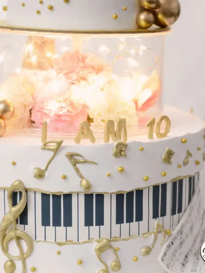 The illuminated tier adds a magical glow to this musical masterpiece.